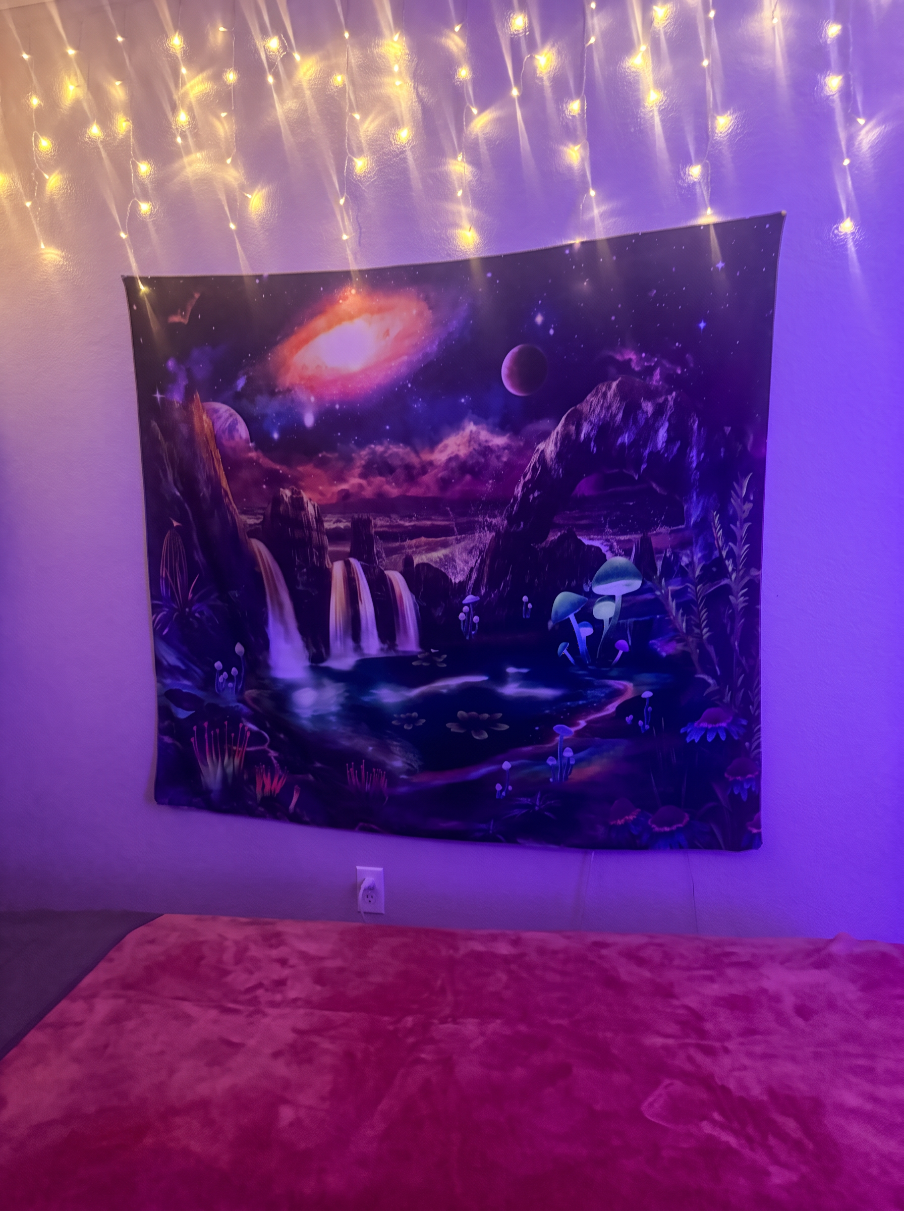 Landon's treatment room with a galaxy waterfall tapestry glowing under warm string lights